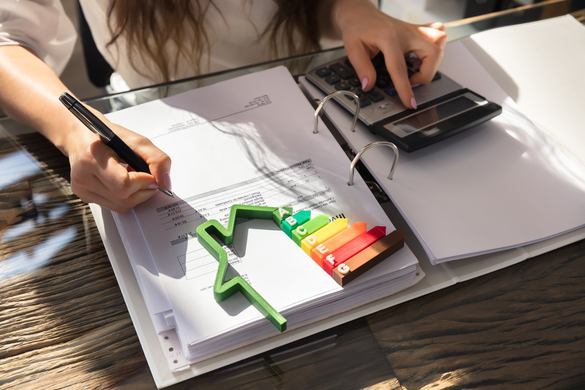 A person calculating something on a peice of paper